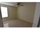 Simple bedroom with tile floors and a closet at 1924 Lake Atriums Cir # 59, Orlando, FL 32839