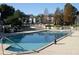 Community pool with lounge chairs at 1924 Lake Atriums Cir # 59, Orlando, FL 32839