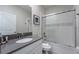 Clean bathroom with a shower/tub combo and gray countertops at 2759 Bookmark Dr, Kissimmee, FL 34746