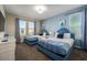 Spacious bedroom with two twin beds and blue themed decor at 2759 Bookmark Dr, Kissimmee, FL 34746