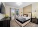 Bedroom with a queen-size bed and neutral color palette at 2759 Bookmark Dr, Kissimmee, FL 34746