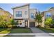 Modern two-story home with attached garage and landscaped lawn at 2759 Bookmark Dr, Kissimmee, FL 34746