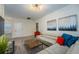 Spacious living area with light grey sectional sofa, a coffee table, and stylish artwork at 2759 Bookmark Dr, Kissimmee, FL 34746