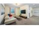 Bright living room featuring a sectional sofa, a large TV, and a stylish wall accent at 2759 Bookmark Dr, Kissimmee, FL 34746