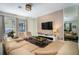 Open concept living room with sectional sofa and large TV at 2759 Bookmark Dr, Kissimmee, FL 34746
