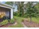 Landscaped backyard with screened porch and wooded area at 2920 Oak Park Way # Apt A, Orlando, FL 32822