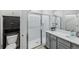 Bathroom with a walk-in shower, toilet and gray vanity at 2920 Oak Park Way # Apt A, Orlando, FL 32822