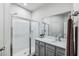 Bathroom with a walk-in shower and gray vanity at 2920 Oak Park Way # Apt A, Orlando, FL 32822
