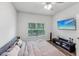 Bedroom with a queen bed, TV, and ceiling fan at 2920 Oak Park Way # Apt A, Orlando, FL 32822