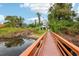 Picturesque boardwalk path leading to a community building at 2920 Oak Park Way # Apt A, Orlando, FL 32822