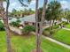 Community clubhouse with pool and lush landscaping at 2920 Oak Park Way # Apt A, Orlando, FL 32822
