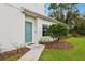 Inviting front door entry with teal door and landscaped walkway at 2920 Oak Park Way # Apt A, Orlando, FL 32822