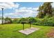 Community grilling area with two grills and lake views at 2920 Oak Park Way # Apt A, Orlando, FL 32822