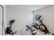 Home gym with elliptical, rower and weight bench at 2920 Oak Park Way # Apt A, Orlando, FL 32822