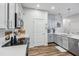 Modern kitchen with stainless steel appliances and white cabinets at 2920 Oak Park Way # Apt A, Orlando, FL 32822