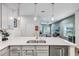 Modern kitchen with white cabinets, stainless steel appliances, and an island at 2920 Oak Park Way # Apt A, Orlando, FL 32822