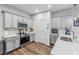 Modern kitchen with stainless steel appliances and white cabinetry at 2920 Oak Park Way # Apt A, Orlando, FL 32822