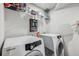 Laundry room with washer, dryer, and shelving at 2920 Oak Park Way # Apt A, Orlando, FL 32822