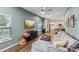 Open concept living area with L-shaped sofa and view of kitchen at 2920 Oak Park Way # Apt A, Orlando, FL 32822