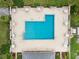 Lush green lawn surrounds a refreshing community pool at 2920 Oak Park Way # Apt A, Orlando, FL 32822