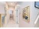 Hallway with bathroom and artwork at 10642 Cloudview Dr, Orlando, FL 32825