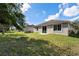 House with backyard, grassy area and fence at 12079 Alder Branch Loop, Orlando, FL 32824