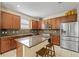 Modern kitchen with granite countertops and wood cabinets at 12079 Alder Branch Loop, Orlando, FL 32824