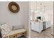 Bench seating in entryway with view of kitchen at 1623 Green Orchard St, St Cloud, FL 34771
