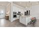 Modern kitchen with white cabinets, large island, and stainless steel appliances at 1623 Green Orchard St, St Cloud, FL 34771