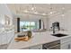 Kitchen island with sink, looking toward living room and sliding glass doors at 1623 Green Orchard St, St Cloud, FL 34771