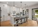 Modern kitchen with white cabinetry, quartz countertops, and island at 1627 Illinois St, Orlando, FL 32803