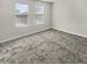 Bedroom with carpet and two windows at 1949 Mountain Pine St, Ocoee, FL 34761