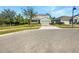 Two-story house on a corner lot with a paved driveway and green grass at 1949 Mountain Pine St, Ocoee, FL 34761