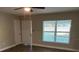 Bright living room with hardwood floors and access to other rooms at 2011 N Hastings St, Orlando, FL 32808