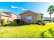 Two-story house with landscaping and a large window at 284 Vista Dr, Davenport, FL 33897