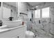 Modern bathroom with walk-in shower and floating vanity at 2912 Sunset Lakes Blvd, Kissimmee, FL 34747