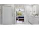 Bathroom with double vanity and view into bedroom at 2912 Sunset Lakes Blvd, Kissimmee, FL 34747
