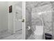 Elegant bathroom with marble tile, soaking tub, and walk-in shower at 2912 Sunset Lakes Blvd, Kissimmee, FL 34747