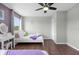 Bright bedroom with a queen-size bed and wood floors at 2912 Sunset Lakes Blvd, Kissimmee, FL 34747