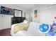 A bedroom with a comfortable bed and a large TV featuring Mario at 2912 Sunset Lakes Blvd, Kissimmee, FL 34747