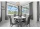 Breakfast nook with round table and four gray chairs at 2912 Sunset Lakes Blvd, Kissimmee, FL 34747