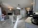 Modern kitchen with island, stainless steel appliances, and marble flooring at 2912 Sunset Lakes Blvd, Kissimmee, FL 34747