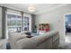 Spacious living room with sectional sofa, large TV, and pool view at 2912 Sunset Lakes Blvd, Kissimmee, FL 34747