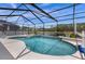 Resort-style pool with spa and lake view at 2912 Sunset Lakes Blvd, Kissimmee, FL 34747
