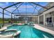 Large screened pool with spa and seating at 2912 Sunset Lakes Blvd, Kissimmee, FL 34747