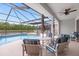 Covered patio furniture near the pool at 2912 Sunset Lakes Blvd, Kissimmee, FL 34747