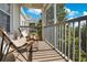 Relaxing screened balcony with chairs and a small table, offering a view of trees at 3190 Dante Dr # 304, Orlando, FL 32835