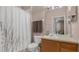 Bathroom with shower/tub combo and wood vanity at 3190 Dante Dr # 304, Orlando, FL 32835