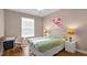 Bedroom with a bed, desk, and large window at 3190 Dante Dr # 304, Orlando, FL 32835