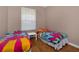 Charming bedroom with twin beds and colorful bedding at 3190 Dante Dr # 304, Orlando, FL 32835
